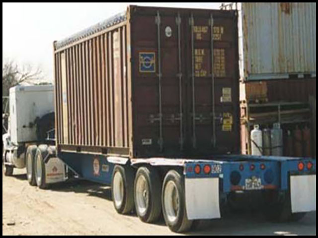Flatbed truck loading containers of soybeans. (Photo courtesy of SB&amp;B Foods Inc., Casselton, N.D.)